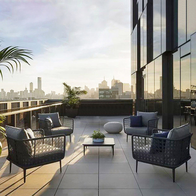 Outdoor rattan furniture set for terrace villa, including rattan chairs, coffee table, and courtyard seating combination