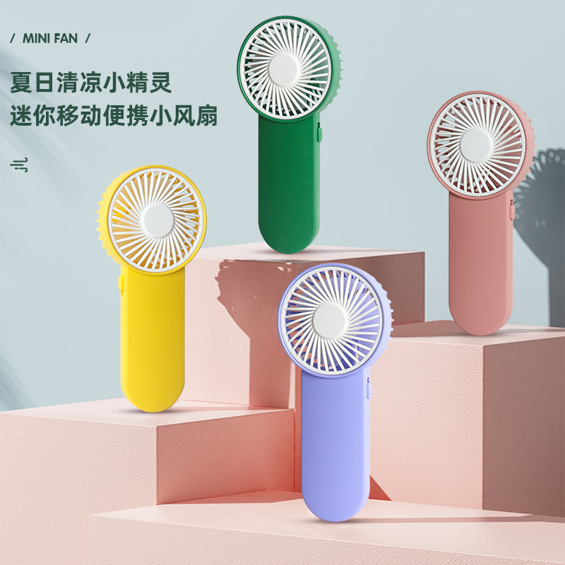Cross-border new wholesale outdoor handheld mini fan, portable, with strong airflow, quiet operation, battery-powered, and suitable as a gift