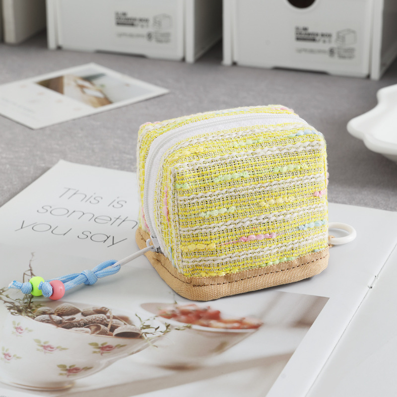 Nuevo mini bolso de llaves de viento de fragancia bolso de cambio lápiz labial de almacenamiento universal para el corazón de la niña conveniente para salir y almacenar en uno