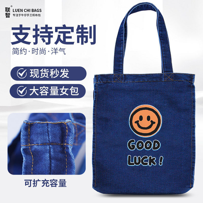 Venta al por mayor de bolsos de hombro único versión coreana de bolsos de lona impresos con letras simples de estilo literario y artístico bolsos de lona de moda y respetuosos con el medio ambiente bolsos de lona portátiles