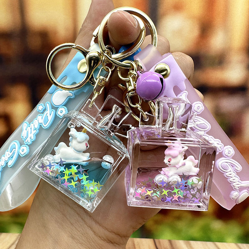 Perfume quicksand bottle unicorn keychain female exquisite cute children's schoolbag ornaments car key chain couple pendant