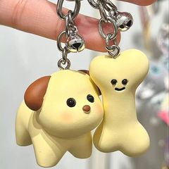 現物の新型アニメは犬のキーホルダーを修理します。