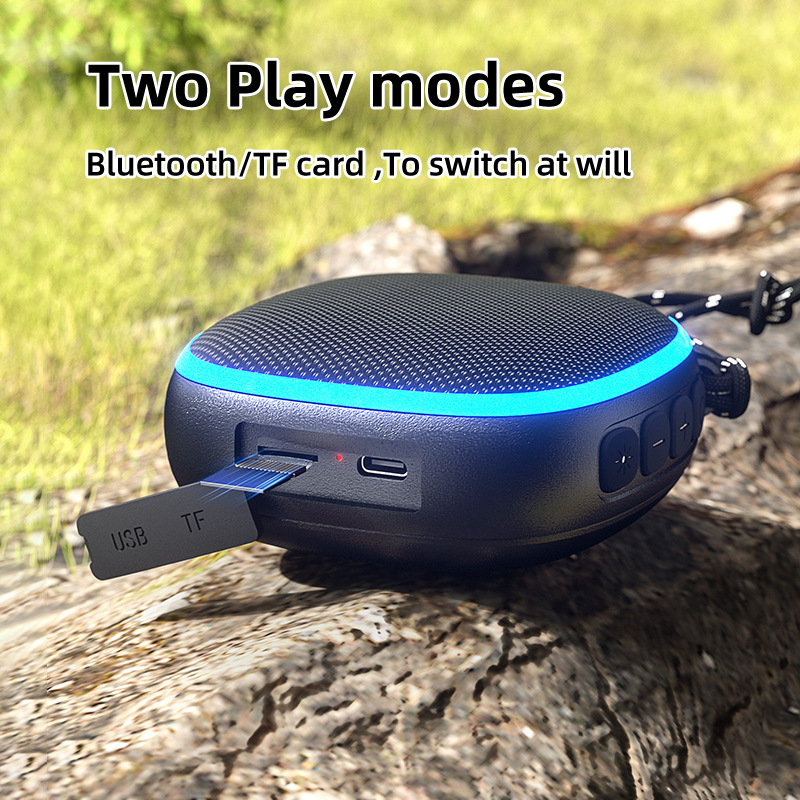 Al aire libre nuevo altavoz Bluetooth de absorción de tela subwoofer al aire libre impermeable portátil mini sonido al por mayor