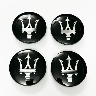 Car logo — Emblem Rear Emblem Xinyicheng - black-background-silver-label-4-diameter-6cm-hub-caps