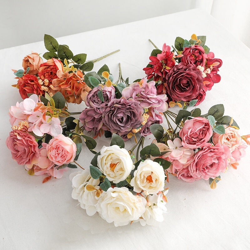 Artificial European-style small bouquet of roses, a decorative floral arrangement for living rooms, featuring six hydrangea, hibiscus, and rose flowers Artificial European-style small bouquet of roses, a decorative floral arrangement for living rooms, featuring six hydrangea, hibiscus, and rose flowers