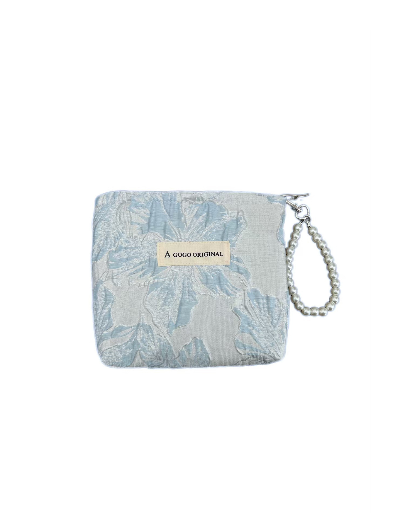 トランペットの高級感のある手は化粧バッグを持っています。布芸の財布を持っています。