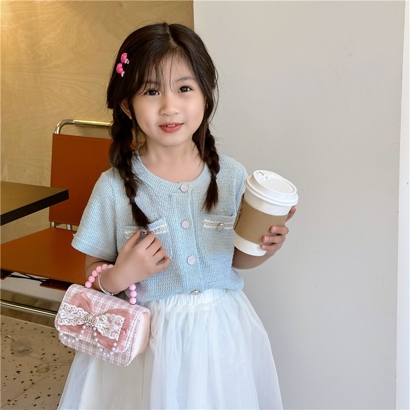 2024 nueva moda lindas bolsas de hombro para niños bolsas de perlas a cuadrícula bolsas extranjeras bolsas de hombro para niñas gran capacidad marea