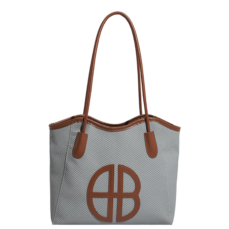 Bolsa de brazo de gran capacidad para viajar 2026 nueva moda bolso de mujer de alto nivel nicho bolso de hombro bolso especial para mujeres
