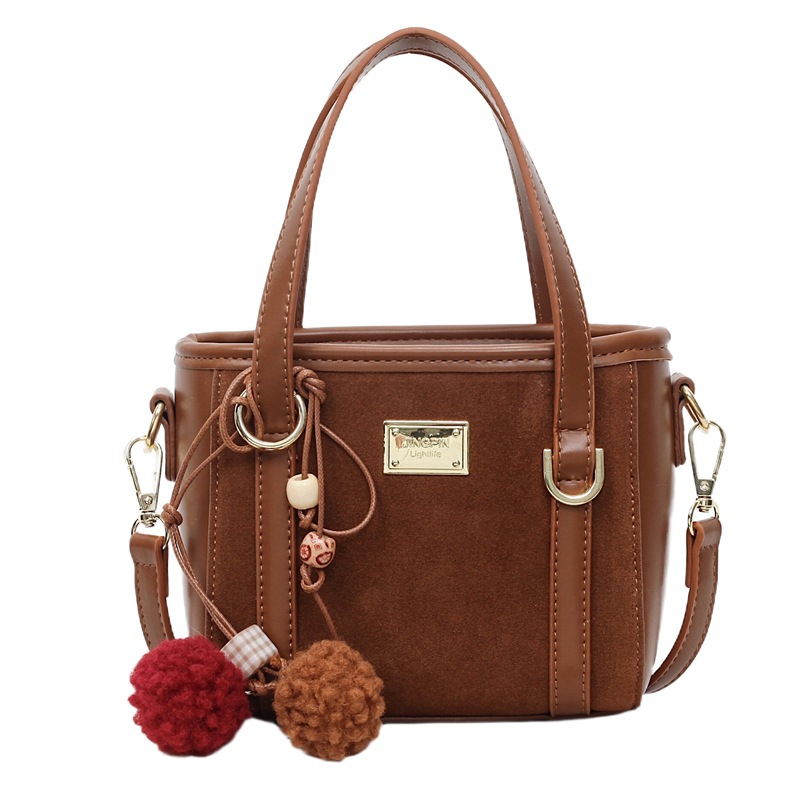 Bolso coreano retro de alta calidad bolso de cubo de agua mujer otoño / invierno 2025 nuevo simple bolso de hombro mochila casual