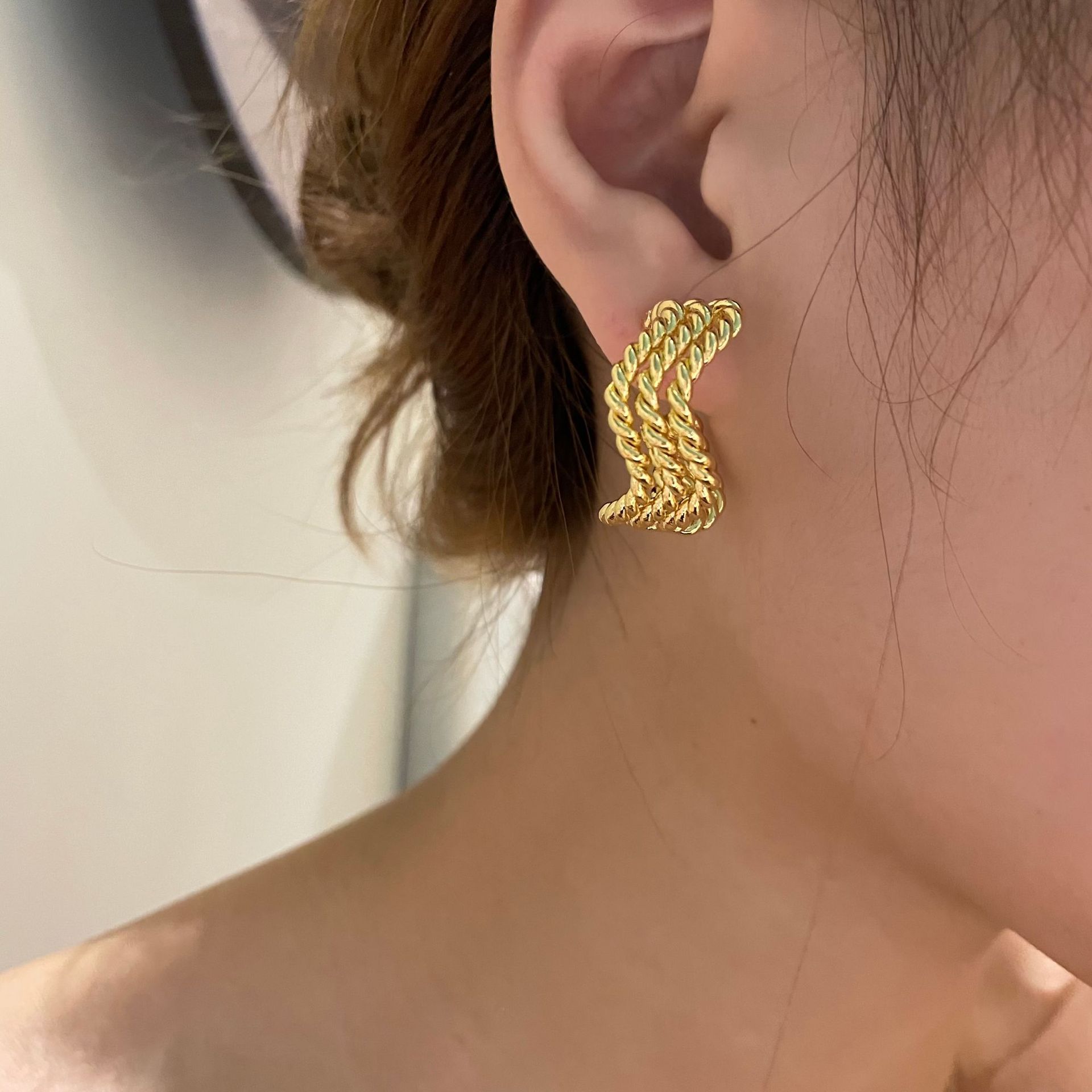 Fashion Gold Plated Metal Texture Wave Winding Earrings display picture 1