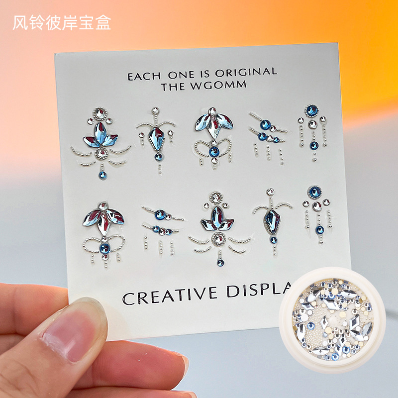 Desgaste de la celebridad en línea paquete de material de uñas caja del Tesoro japonés accesorios de uñas corazón torcido Mariposa Super Flash accesorios de uñas de diamante en forma especial