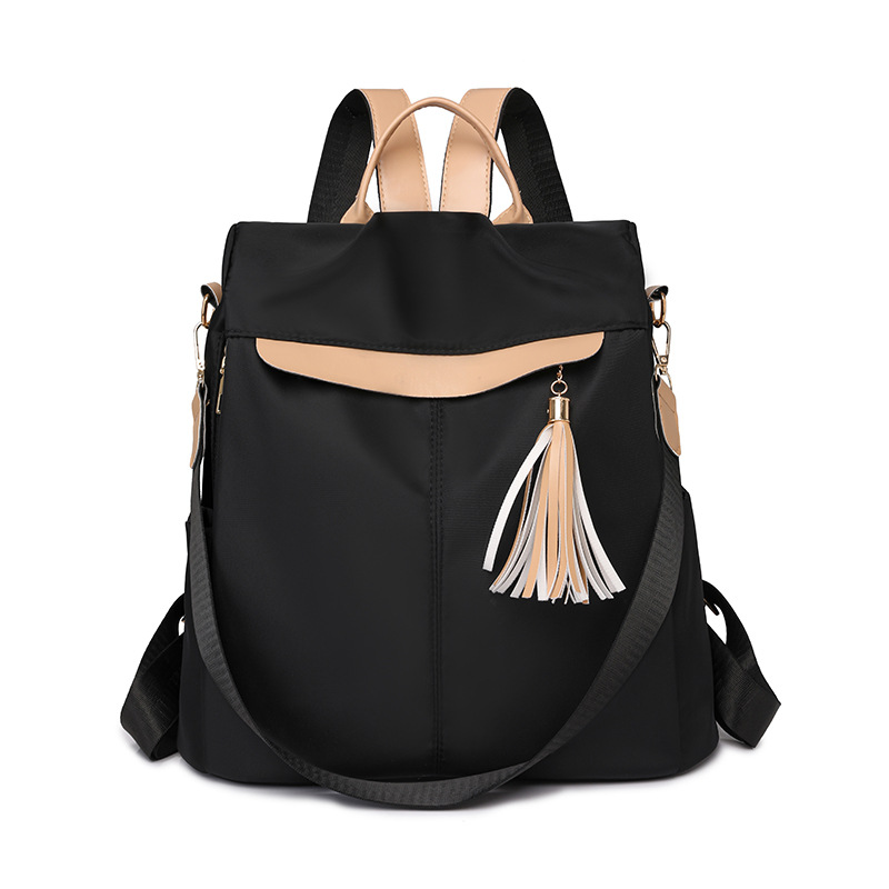 Mochila de nailon ligera casual de moda para mujer nuevo estilo de viaje anti-salpicaduras de agua, resistente al desgaste, antirrobo, mochila de viaje coreana de moda