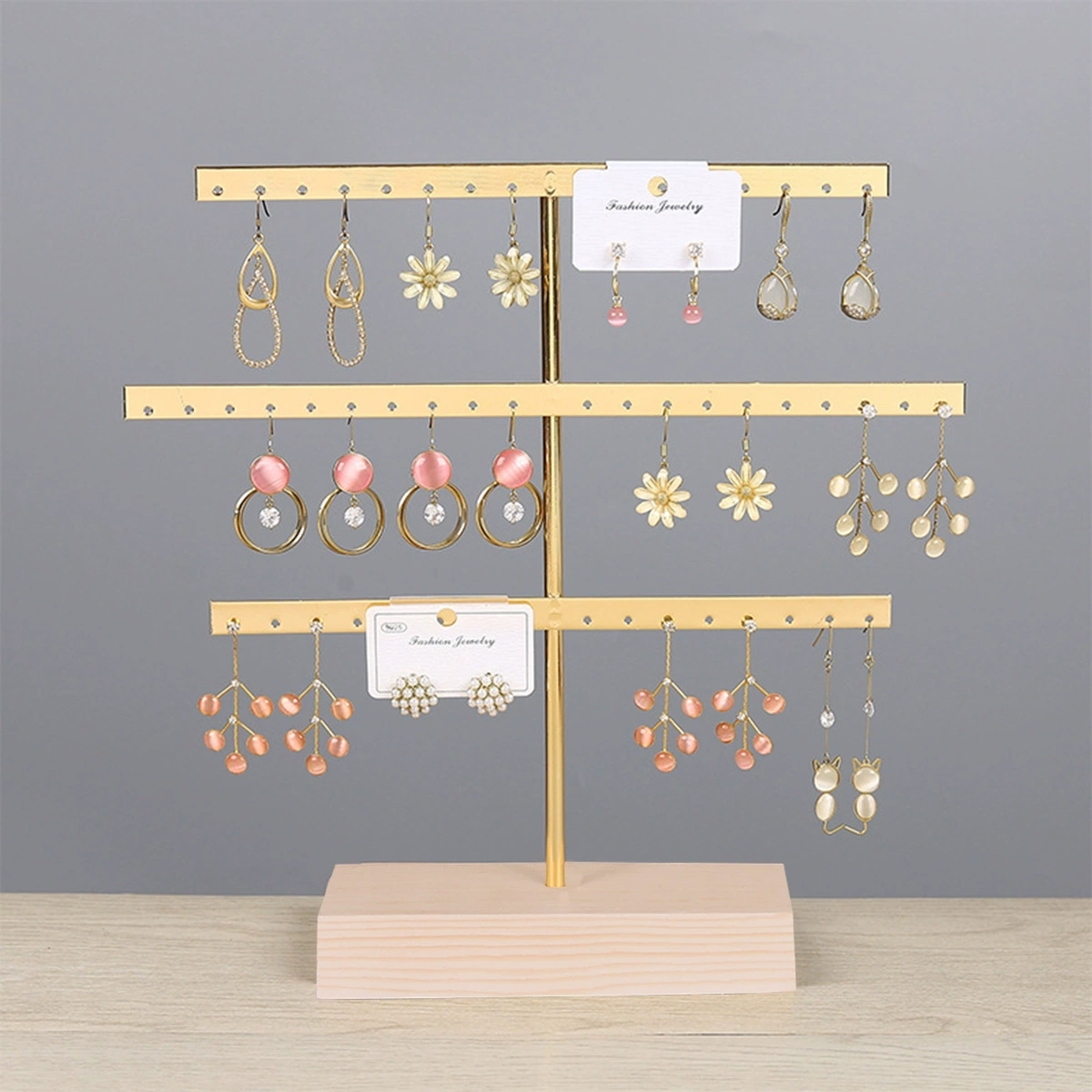 Earrings, golden stand, storage system