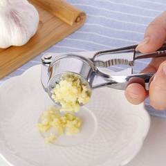 Four-in-one manual garlic press, garlic masher, garlic masher, fish scale scraper, bottle opener, walnut clip, manual garlic punch