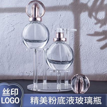 Nueva base líquida de prensado redondo de 30ml de alta gama, botella líquida de esencia, material de embalaje cosmético con tapa redonda galvanoplastia