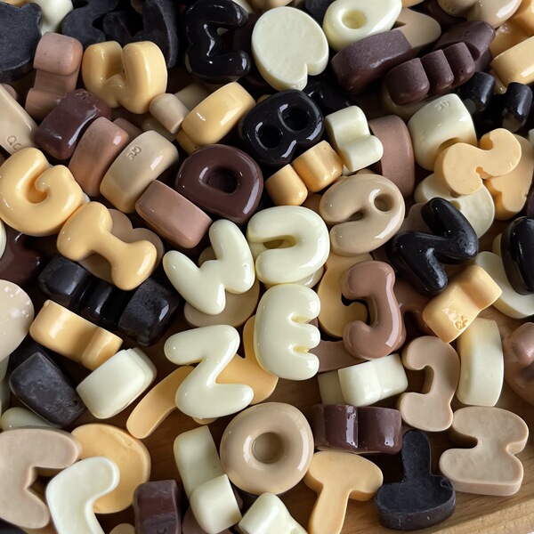 small brown accessories with letters