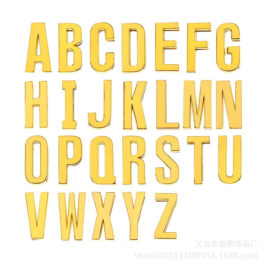 Golden glossy accessory with letters