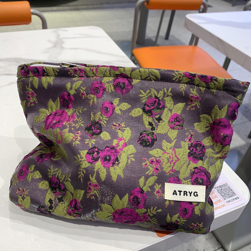 2025 nuevos ins pequeña bolsa de cosméticos morada fresca bolsa de almacenamiento de transporte de viaje portátil bolso de mano premium para niñas