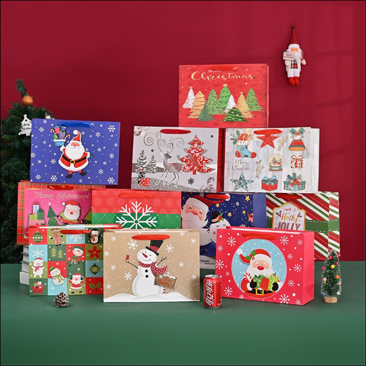 新款卡通图案包装袋210克白卡礼品袋圣诞节牛皮纸手提袋纸袋批发