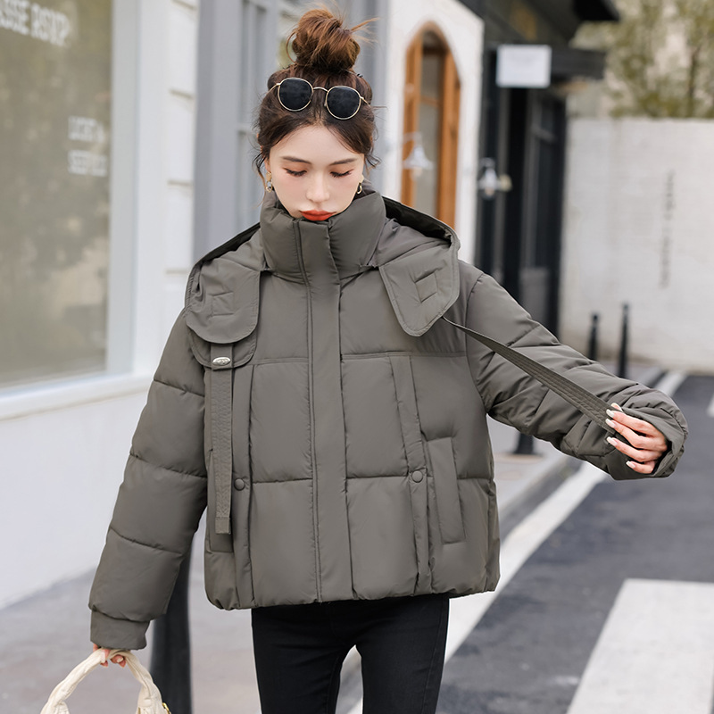 Corea del Sur Dongdamen ropa de algodón de pluma para mujeres corto 2025 invierno nuevo algodón delgado chaqueta con capuz transfronteriza