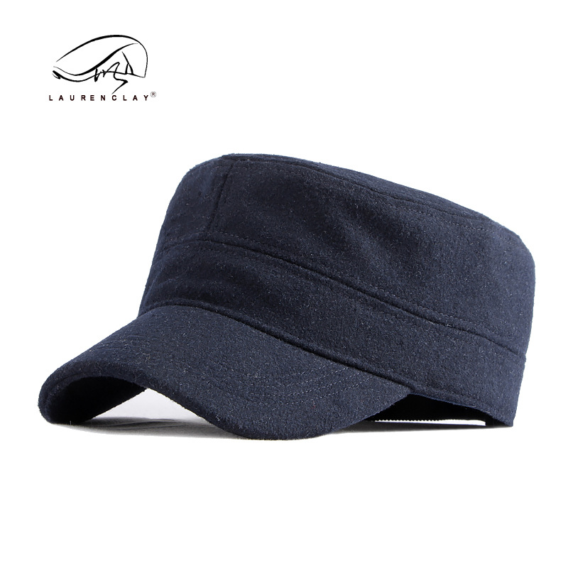 Sombrero al por mayor de los hombres otoño y el invierno lana caliente sellado completo casquillo enarbolado simple luz tablero superior plana azul marino sombrero