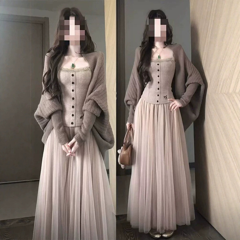Korean-style three-piece work outfit: a gentle batwing-sleeve knitted cardigan, a lace camisole, and a sheer mesh half-skirt, creating a slimming effect