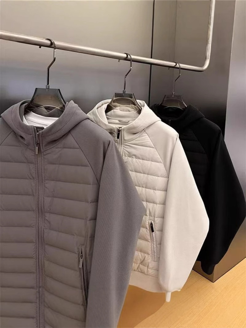 ファッション秋冬2025年帽子付きデザイン感カジュアルな純色の大衆が男性青年の帽子付きコートをつなぎ合わせて保温する