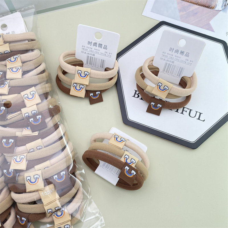 2022 nuevo estilo coreano accesorios para el cabello leche té color Banda para el cabello sin costuras etiqueta de tela Linda cuerda para el cabello 3 tarjetas cabeza cuerda banda de goma