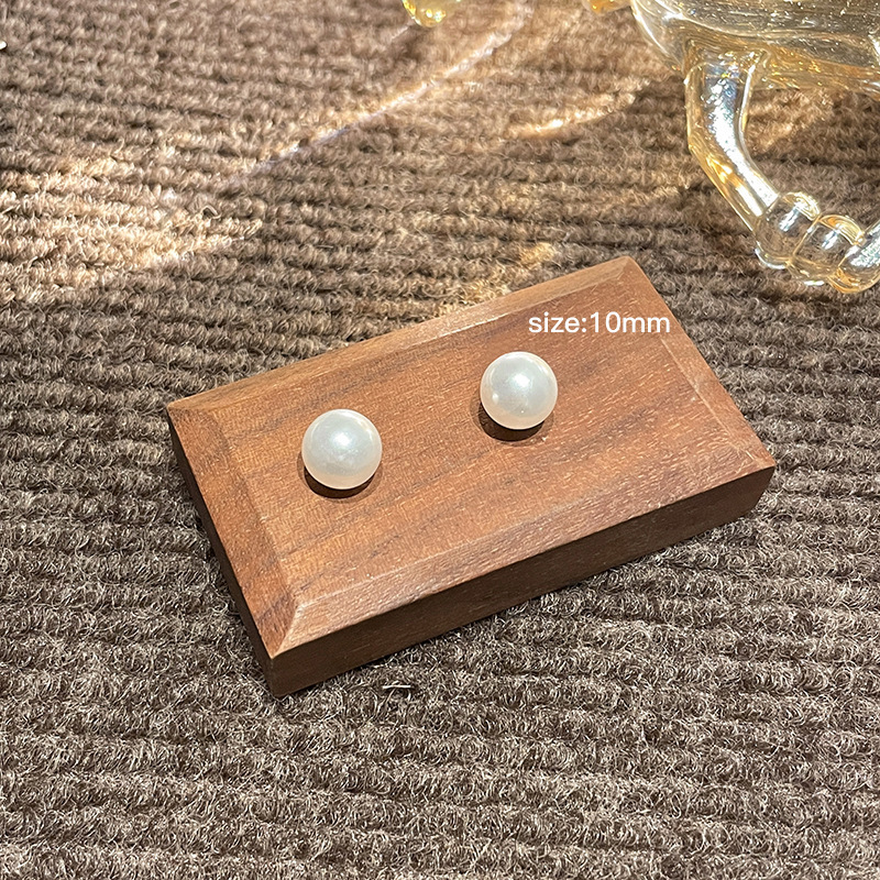 Luz de lujo de alto nivel nicho de diseño femenino sensación de aretes de bordilla temperamento perla asimetría joyería perla al por mayor