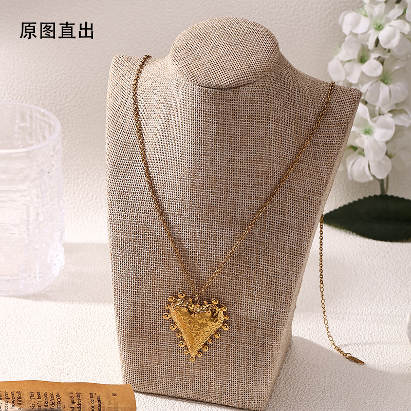 Taina Omei Shein transfronterizo explosión de acero inoxidable chapado en 18k oro texturas de lava colgante en forma de corazón mujeres al por mayor