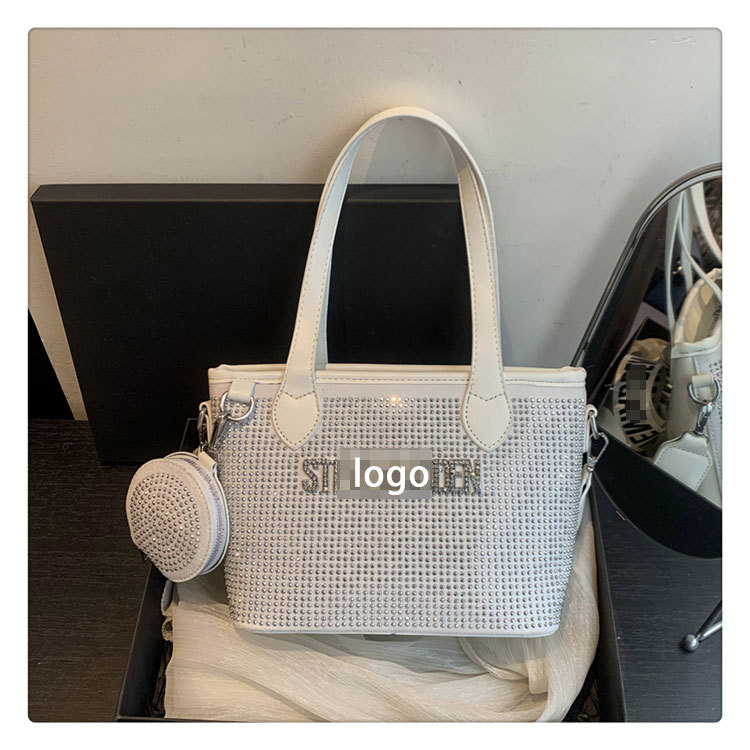 Bolso de letras de diamantes de imitación transfronterizos diseño de nicho femenino moda simple portátil popular 2025 nueva textura bolsa de mensajero