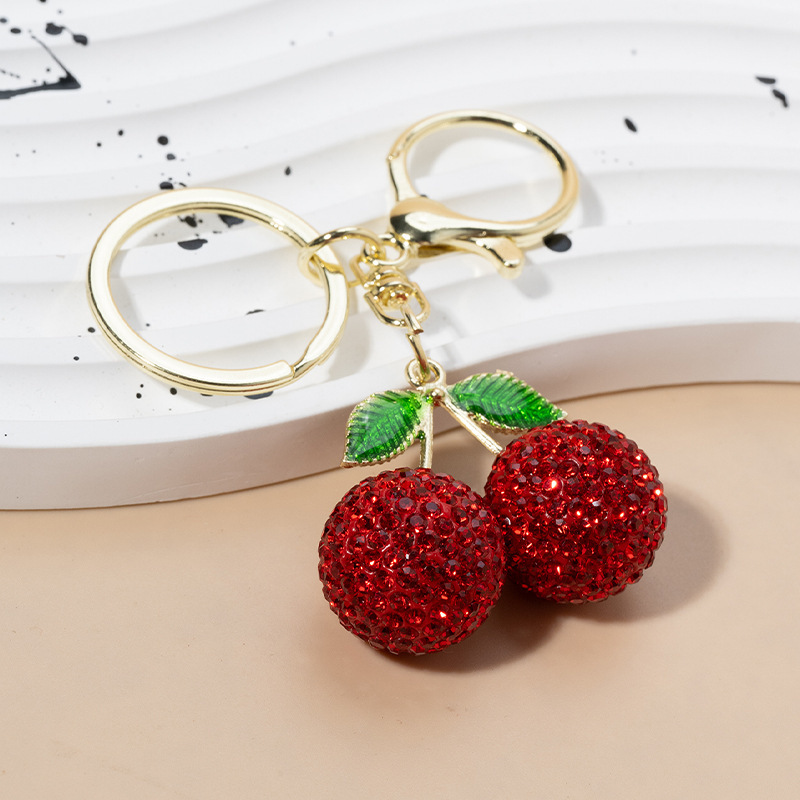 Cross-border creative cute diamond-encrusted cherry key chain pendant car women's bag metal key chain cartoon gift