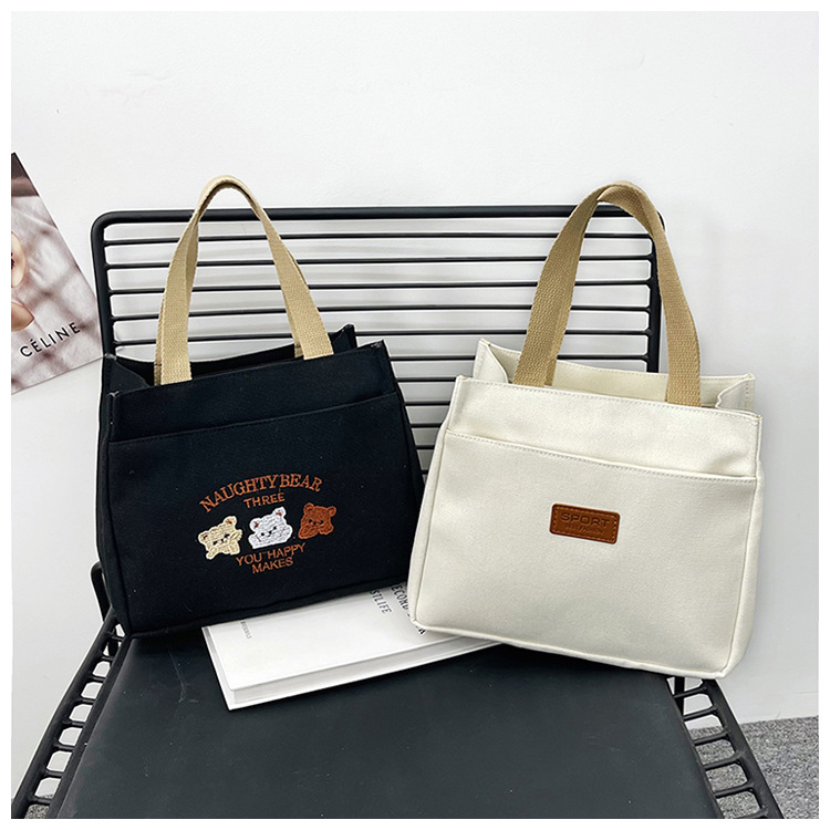 New wholesale fashionable and high-quality canvas handbag, simple and portable, easy to carry for going out, versatile lunch box and bento bag undefined