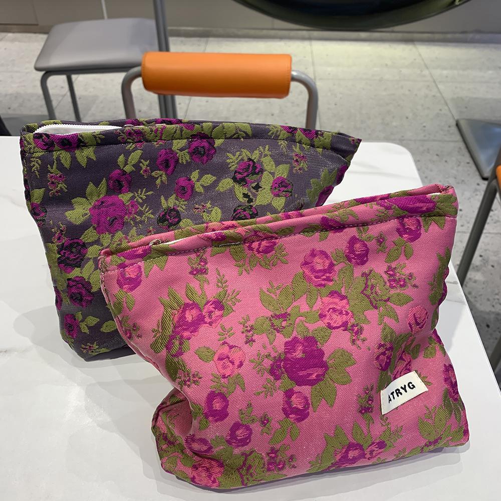 2025 nuevos ins pequeña bolsa de cosméticos morada fresca bolsa de almacenamiento de transporte de viaje portátil bolso de mano premium para niñas