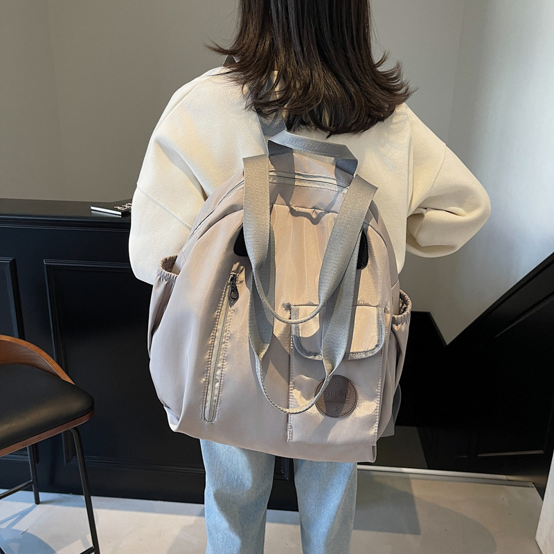 2025 multifuncional simple casual mujer sensación de alto nivel salvaje mochila de viaje de gran capacidad bolso de hombro de mujer multiusos