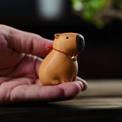 卸売りの南米の黄楊の木のカピバラの置物は解凍してデスクトップの装飾のかわいいカピバラの置物を癒します。