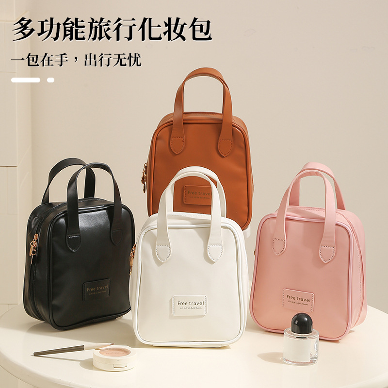 Handheld capacious cosmetic bag