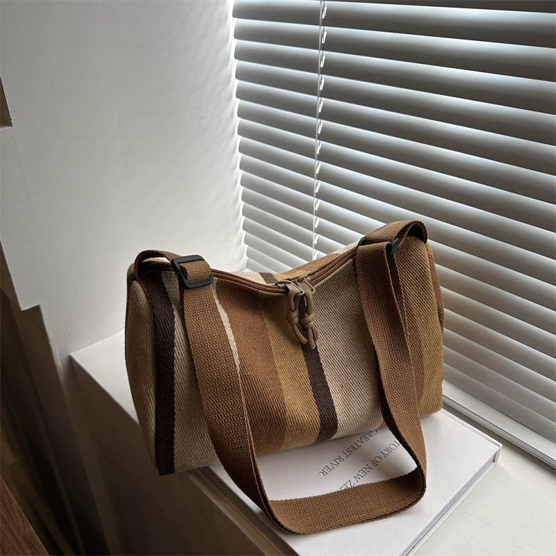 Bolsa de hombro coreana de gran capacidad para mujeres 2024 nuevo estilo simple a rayas verticales mochila casual bolso de almohada de moda