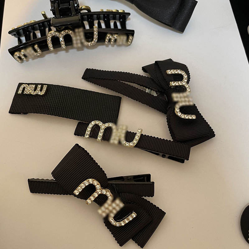 Elegant black hairgrip with letters