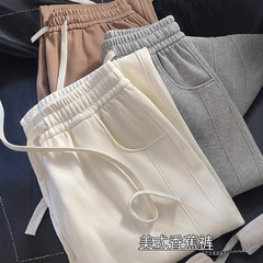 卸売ソリッドカラーバナナスポーツパンツワイドレッグパンツ女性のための春と秋の新しいハイウエストルーズストレートカジュアルスウェットパンツトレンディ