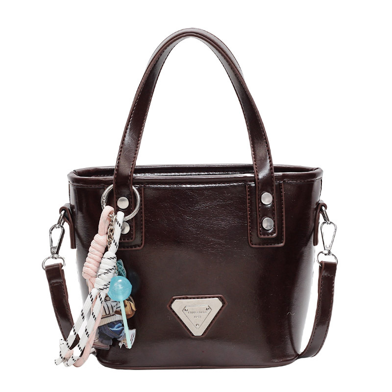 Paquete portátil de cuero de cera de aceite de alta calidad para mujeres 2025 nuevo estilo coreano bolso de hombro de estilo extranjero bolso retro versátil