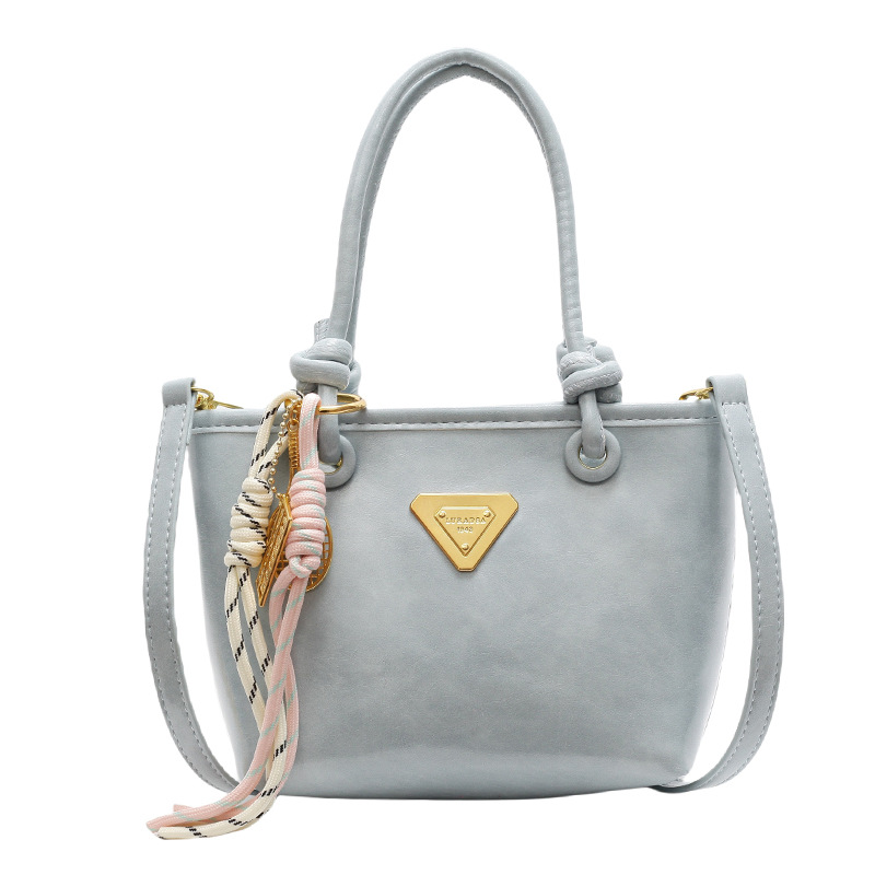 Bolso de mano simple de estilo extranjero para mujeres 2025, nuevo bolso de cubo de alta calidad, bolso de hombro casual simple