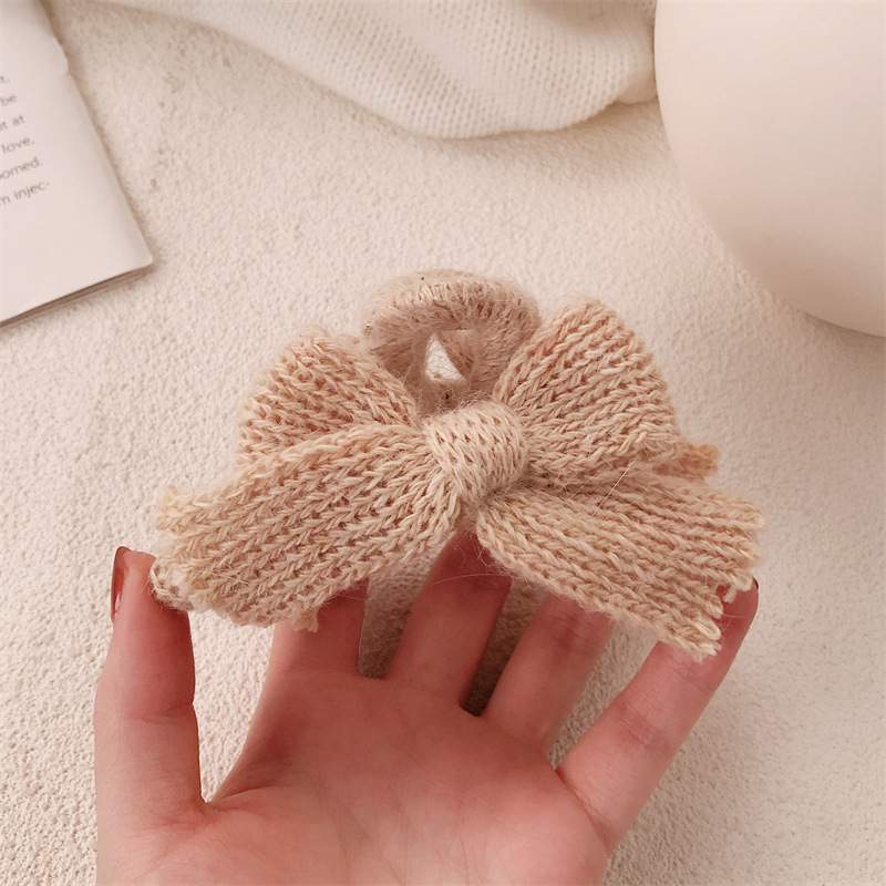 Otoño y invierno nuevo arco lana de punto pinzas de cabello de alta sensación otoño y invierno tocado de Año Nuevo rascar pinzas de pescado para mujeres