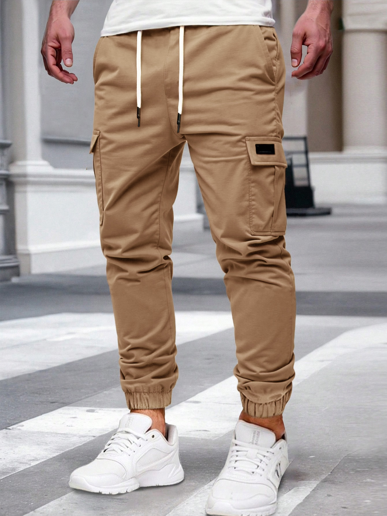 Nuevos pantalones de estilo europeo transfronterizo de hombre de bolsillo multi-bolsillo, pantalones de estilo de moda de comercio exterior.