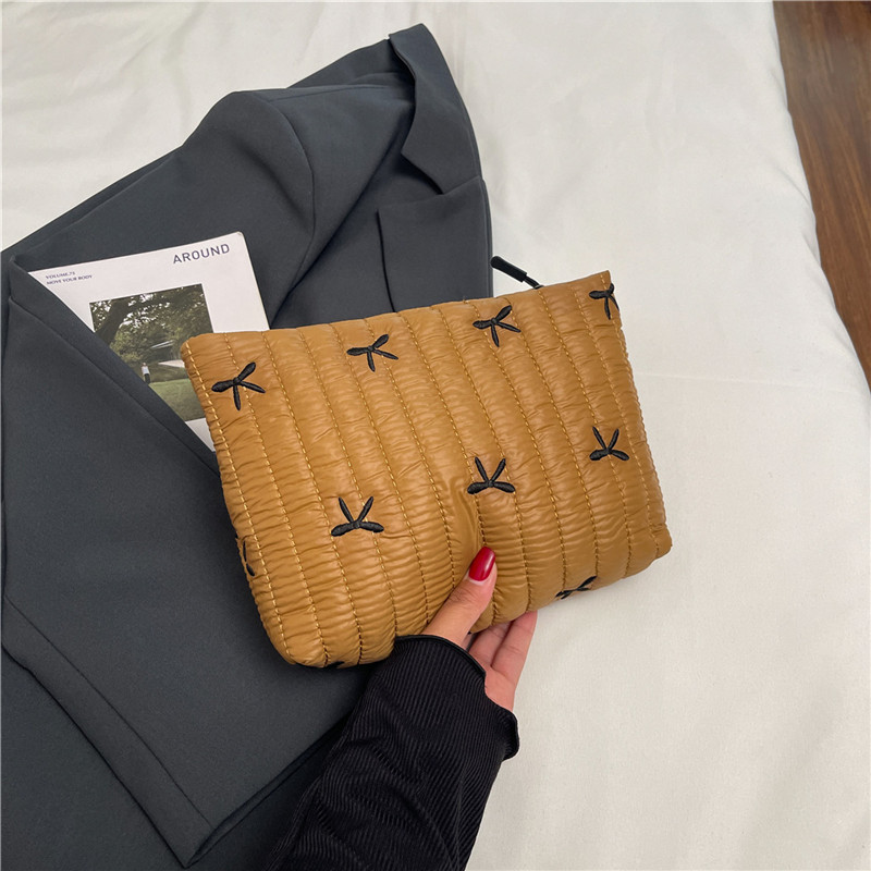 2025 invierno nueva moda portátil bolso de mano mecha de moda impresión mariposa de maquillaje de gran capacidad bolso de mano