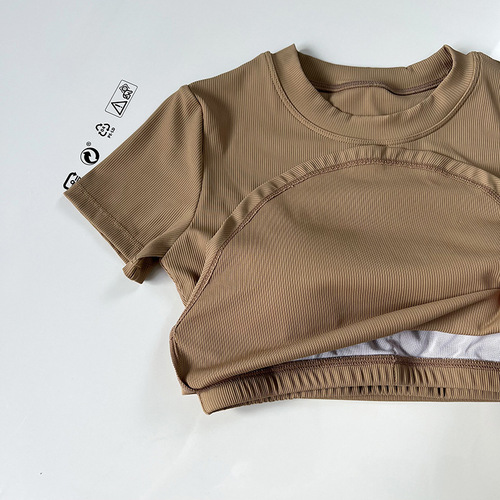 Soft threaded yoga clothes with chest pads and exposed waist. Slim-fitting round neck fitness tops. Summer breathable sports short-sleeved T-shirts.
