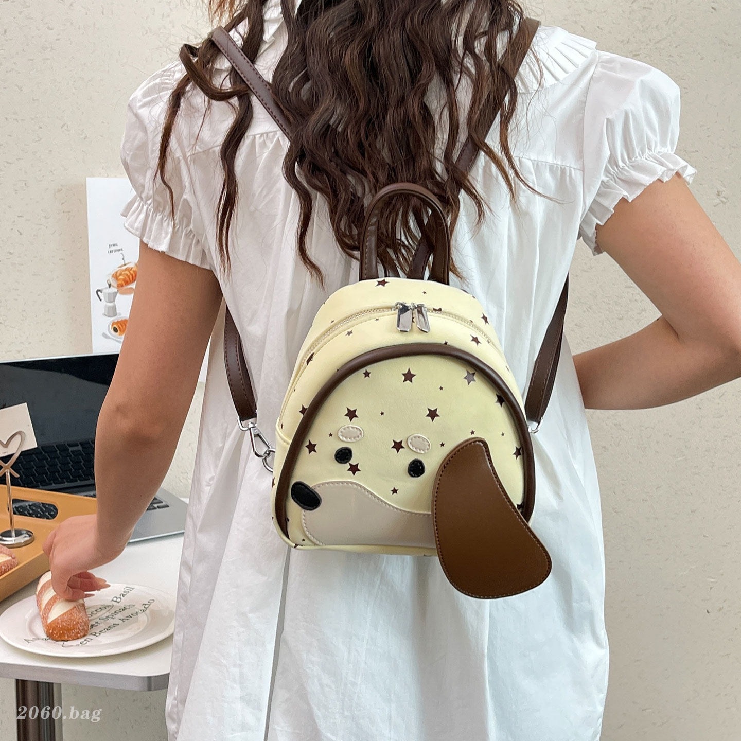 Estrellas de gran capacidad de dibujos animados temperamento perro nuevo diseño nicho mochila 2026 versión coreana de mujeres viajeros