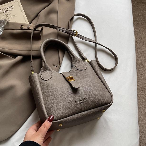 Este año, la popularidad de la bolsa de cubo para mujeres de alta calidad 2025 nuevo bolso casual de moda, bolso de hombro de moda