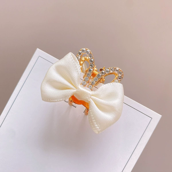 White rabbit with bow