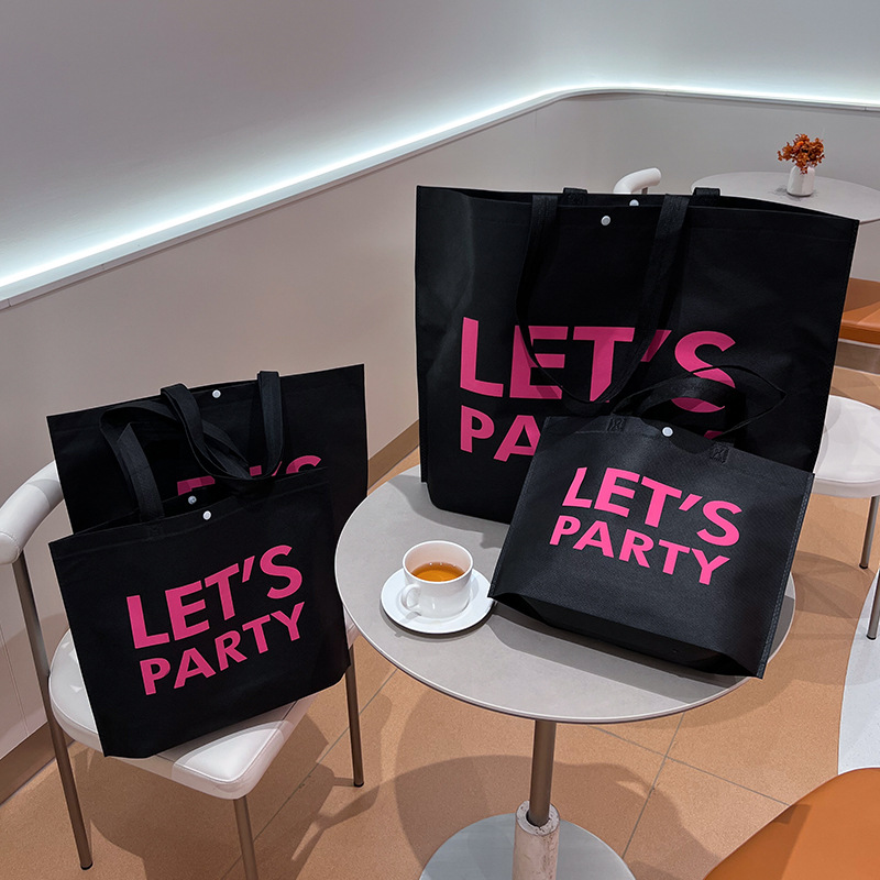 Bolso de mano no tejido de gran capacidad personalizado LOGO engrosado ropa de mujer protección ambiental bolsa de publicidad bolsa de compras de la tienda de ropa